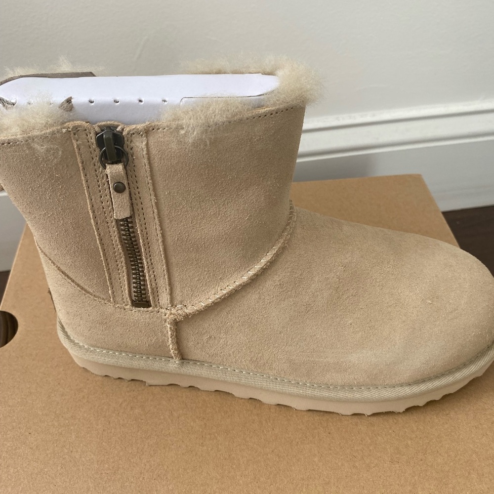 SOLD: Ugg New in a box size 7. Classic mini double zip. Color Mustard.
